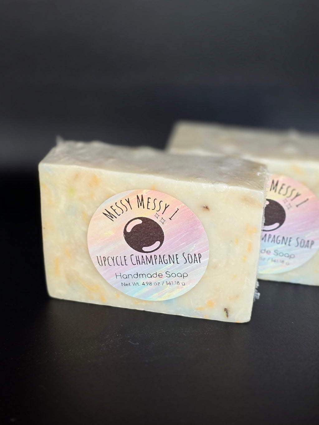 Upcycle Champagne - a handcrafted cold process soap made in small batches using recycled soap shavings from previous MessyMessy1 batches, creating a unique confetti-style design with a light champagne-inspired scent.